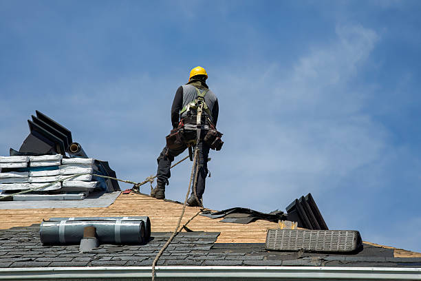 Professional Roof Replacement technician working in Cove, OR